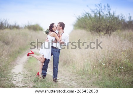 wedding couple in national costume in meadow