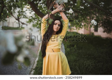 Beautiful girl in yellow dress