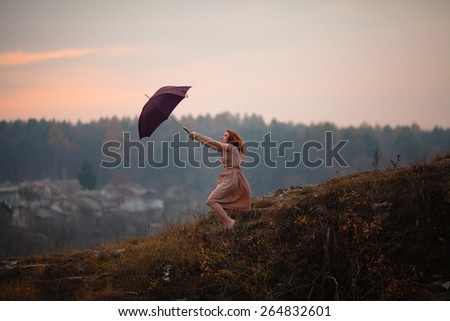 redhead girl with umbrella