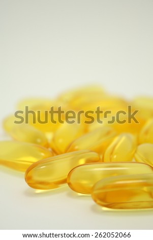 closeup many Fish Oil omega 3 soft gel capsules isolated On White Background