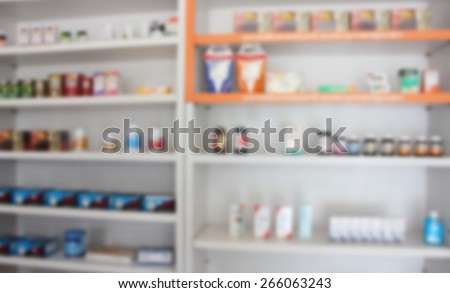 blur shelves of medicine and dietary supplement in the pharmacy drugstore