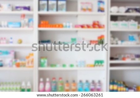 some shelves filled with medication in a pharmacy drugstore