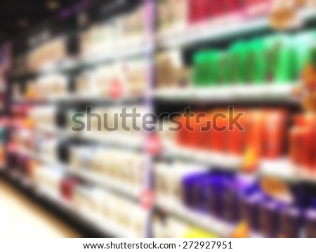 blur view of beverage product on refrigerator shelves in supermarket