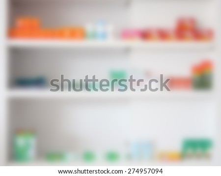blur some shelves filled with medication in a pharmacy drugstore
