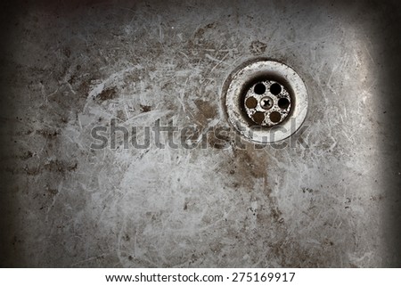 very old dirty sink with rusty metal drain