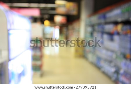 pack of water bottles in supermarket store blur background with bokeh