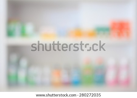 some shelves filled with medication in a pharmacy drugstore blur defocused background