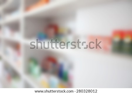 blur pharmacy drugstore shelves background with medicine drug