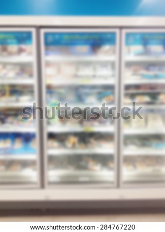 supermarket blur with refrigerator and frozen food