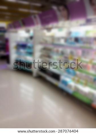 blurred beauty and cosmetics shelves in supermarket