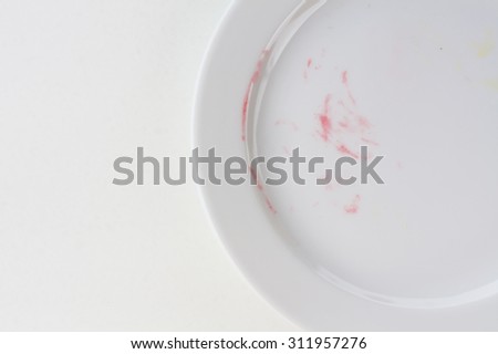 empty plate on white table after blackberry pie