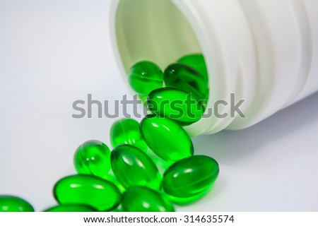soft gel capsule vitamins pills in green color