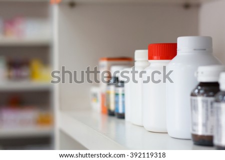 medicine bottles on pharmacy store shelf