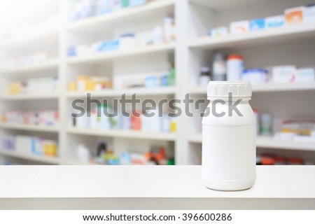 white medicine bottle on counter in the pharmacy