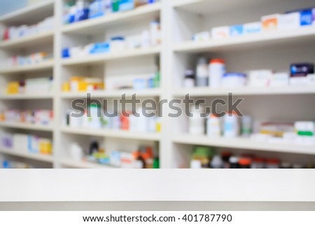 pharmacy product display counter with drugstore shelves background
