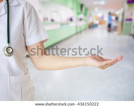 female doctor with blur photo of hospital background