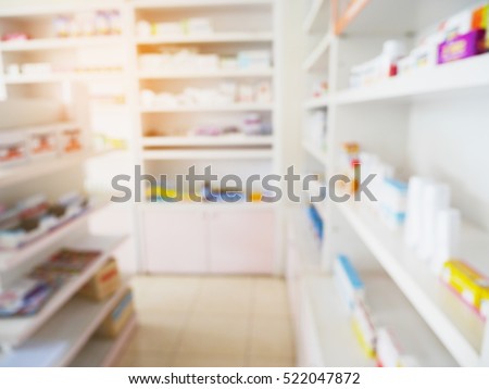 pharmacy store with blur shelves filled with medication