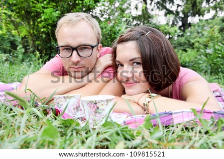 http://image.shutterstock.com/display_pic_with_logo/298474/109815521/stock-photo-young-couple-man-and-woman-laying-on-picnic-109815521.jpg