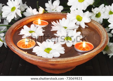 Aroma Therapy Bowl with Flowers on Dark Background