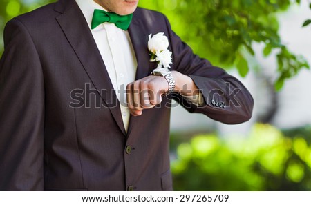 business man  looking at watch over white background