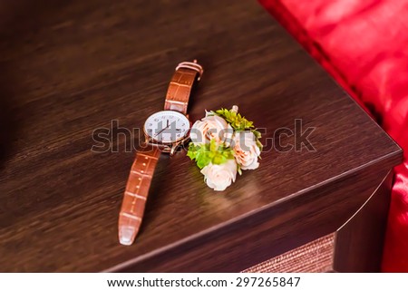 Luxury watch, chronograph closeup, beautifull white boutonniere