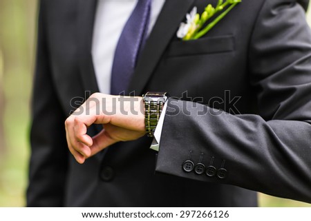 business man  looking at watch over white background