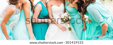 bride and bridesmaids dressed in a blue dress