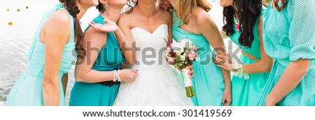 bride and bridesmaids dressed in a blue dress
