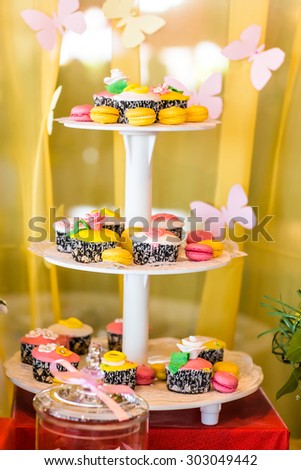 Dessert table for a party. cake and cupcakes