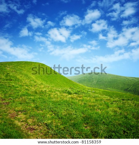 green hills and blue sky with clouds in Carpathian mountains