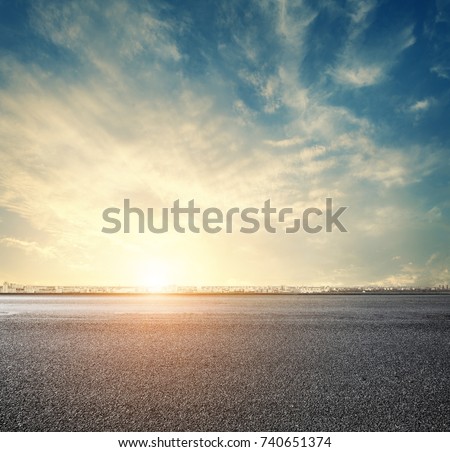 road and sunset sky above city, urban scenery