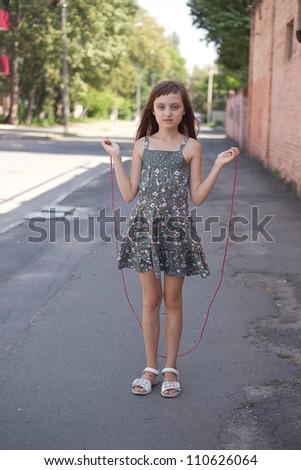 girl jumping with skipping rope