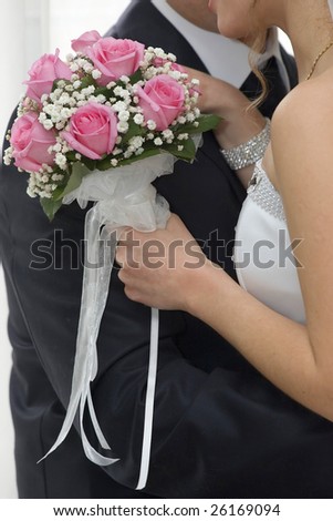 stock photo Rose flowers wedding bouquet hands of bride and groom