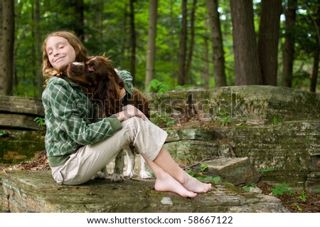 tween girl with her springer spaniel dog