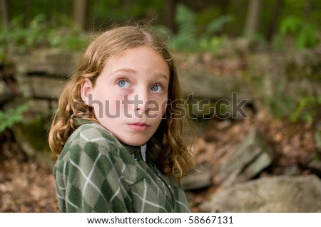 tween girl looking sideways with a humorous expression