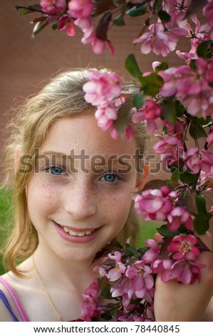tween girl with apple blossoms
