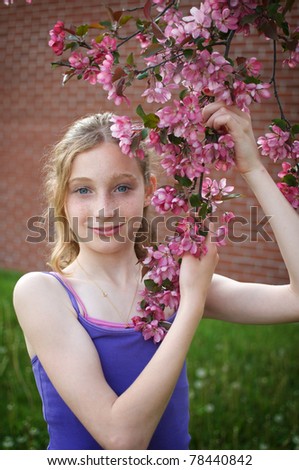 tween girl with apple blossoms