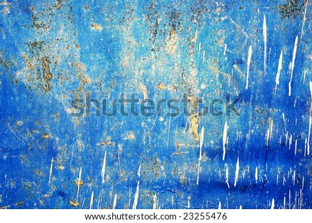 blue, rasty, metal wall with white paints on