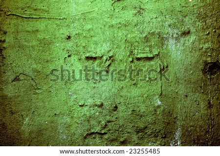 Green, aged, grungy wall with high detail and contrast