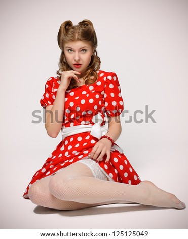   White Polka  Dress on Pretty Pinup Model In A Red And White Polka Dot Dress Stock Photo