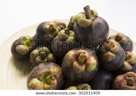 mangesteen fresh fruit purple violet background peel