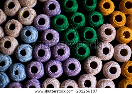 yarns of threads for knitting in different colors background