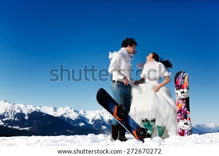 bride and groom in love jump on the background of the Alps Courchevel