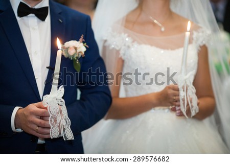 wedding ceremony of stylish elegant brunette bride and groom win the old church
