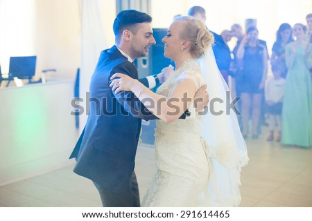 first dance full  in love cute just married couple on a background of restaurant