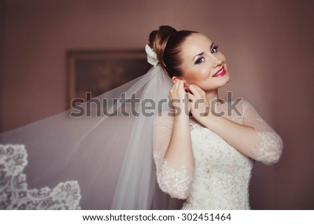 stylish gorgeous young beautiful bride dressed in fashionable  wedding dress