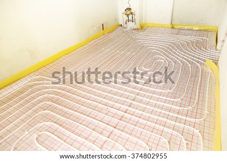 Conduct a warm floor under the laminate or tile in the room in a new apartment. Electric floor heating.