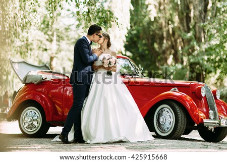 Sensual kiss of the two in their wedding day