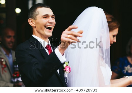 Broad smile of a groom after a wedding ceremony