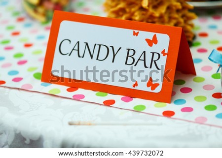 Lettering \'candy bar\' stands on a table in restaurant